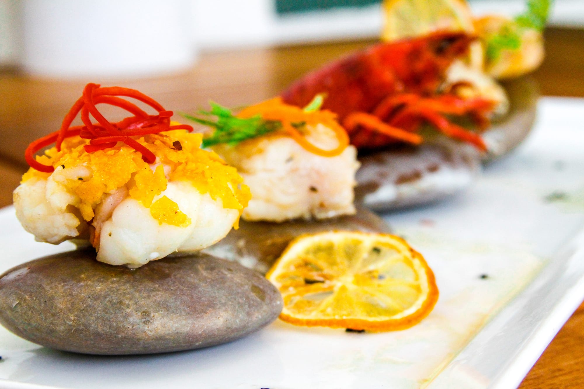 Antigua — a gourmet Caribbean lobster presentation on river stones