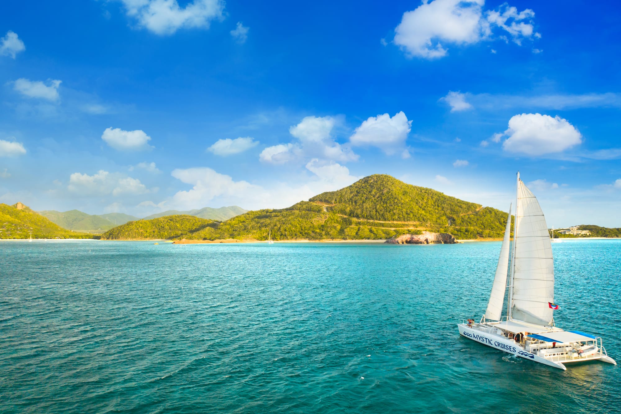 Five Islands Harbour, Saint John's, Antigua — sailing a catamaran through the turquoise waters of Five Islands Harbour